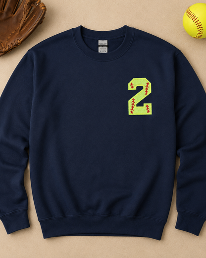 Navy personalized softball number 2 appliqué sweatshirt flat lay with softball accessories