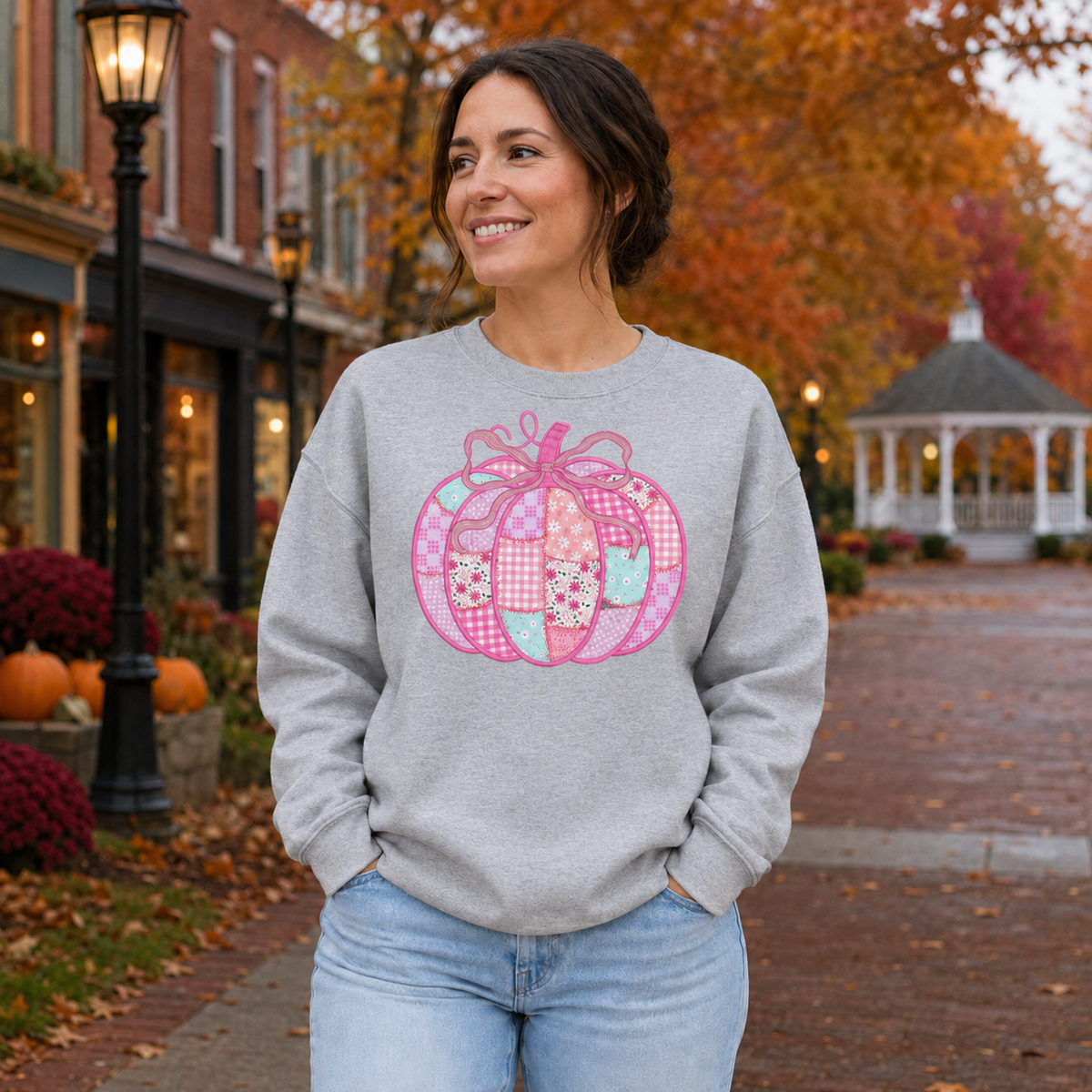 Sport Grey Gildan Softstyle sweatshirt with a pink patchwork bow pumpkin DTG design