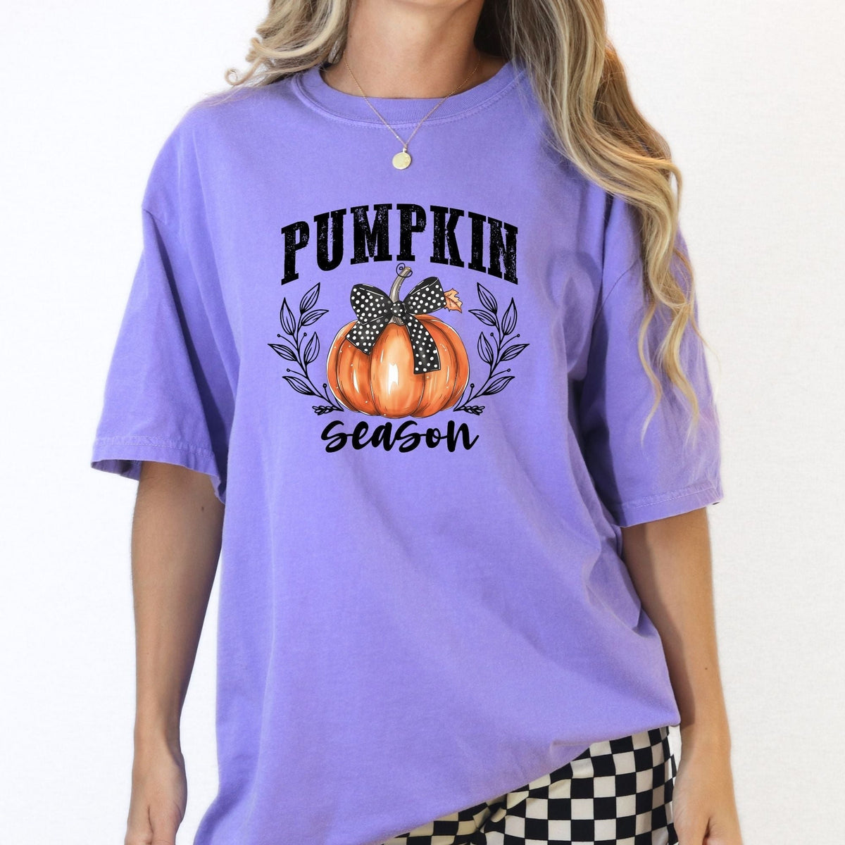 Front view of an Orchid pumpkin bow fall graphic tee for women.
