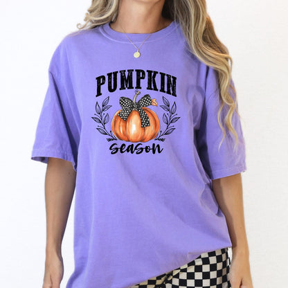Front view of an Orchid pumpkin bow fall graphic tee for women.