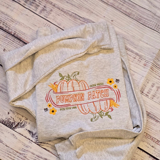 Ash embroidered Pumpkin Patch sweatshirt with farm fresh pumpkins, flowers and autumn leaves
