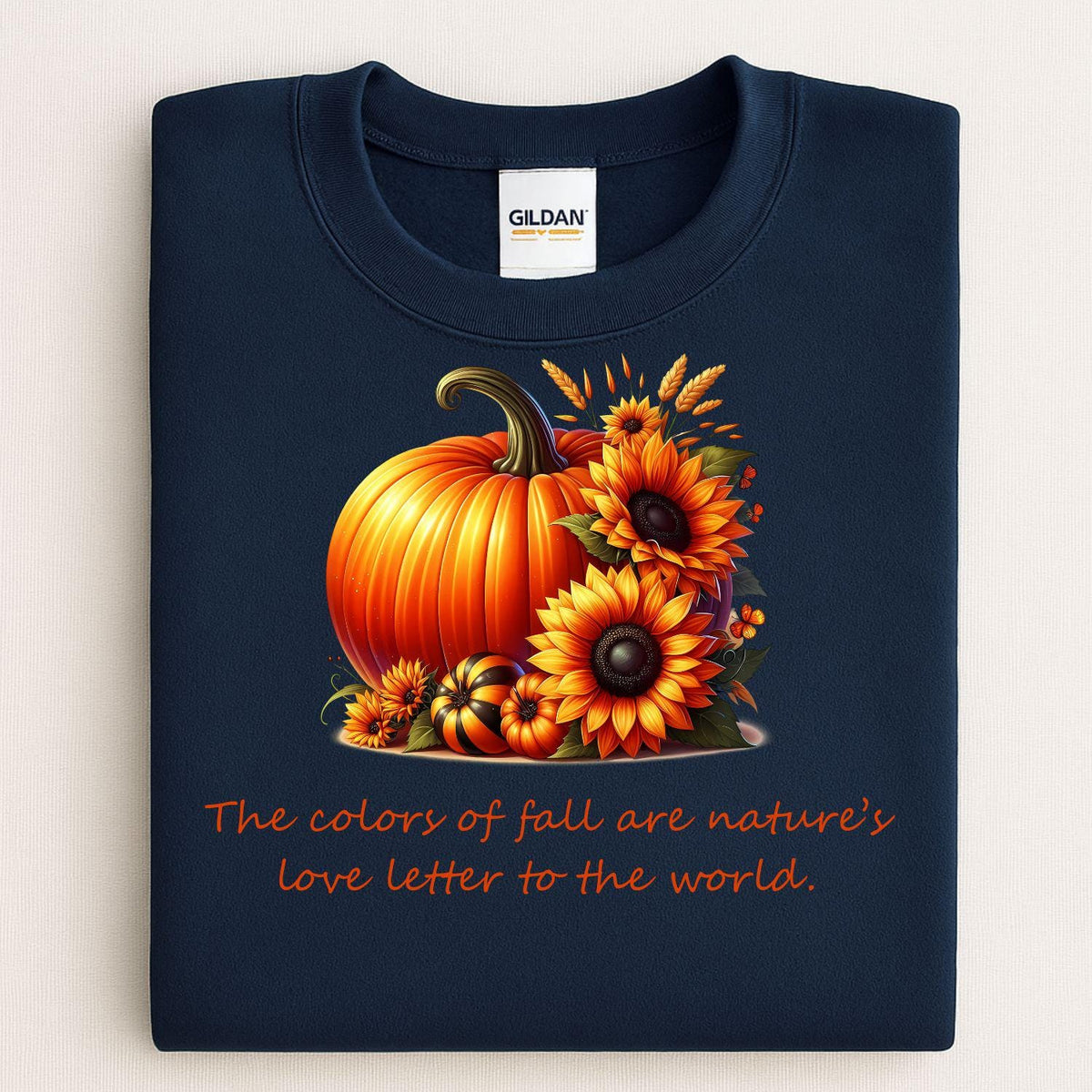 Navy sweatshirt with a pumpkin sunflower fall graphic folded flat