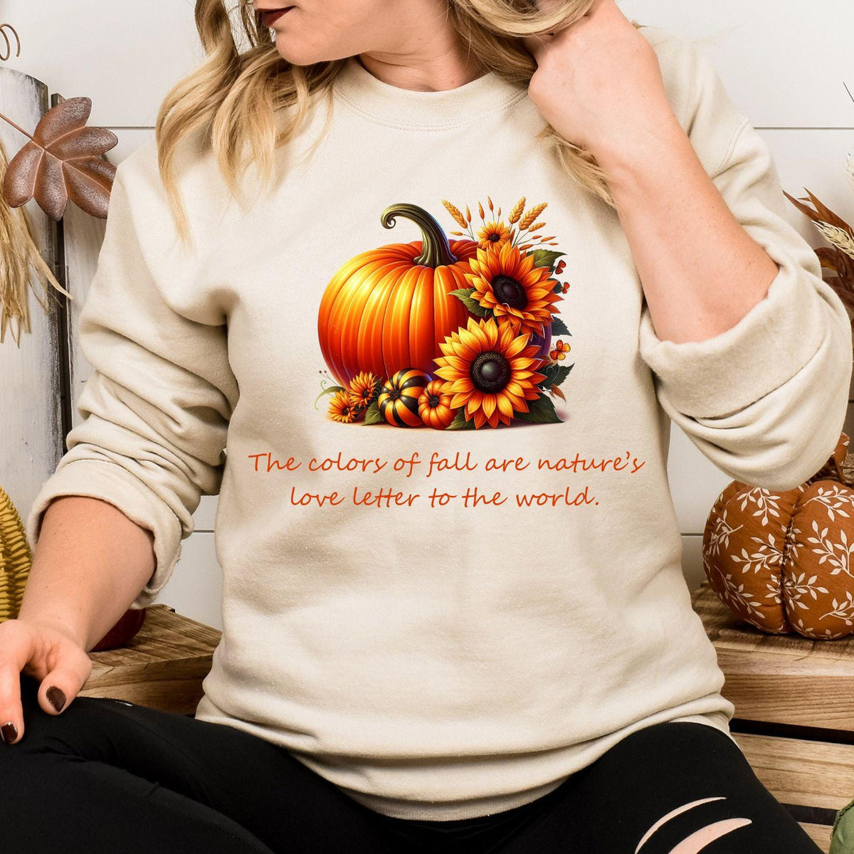 Sand pumpkin sunflower graphic sweatshirt modeled indoors