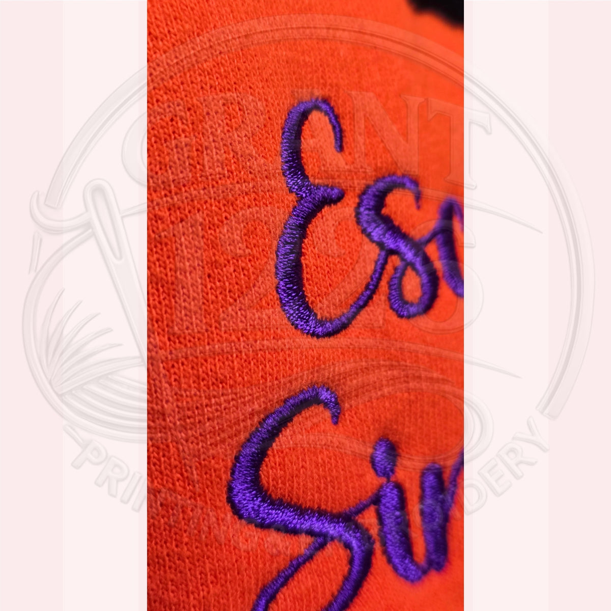 Close-up of purple embroidery on orange Escaped Since 1692 Halloween sweatshirt