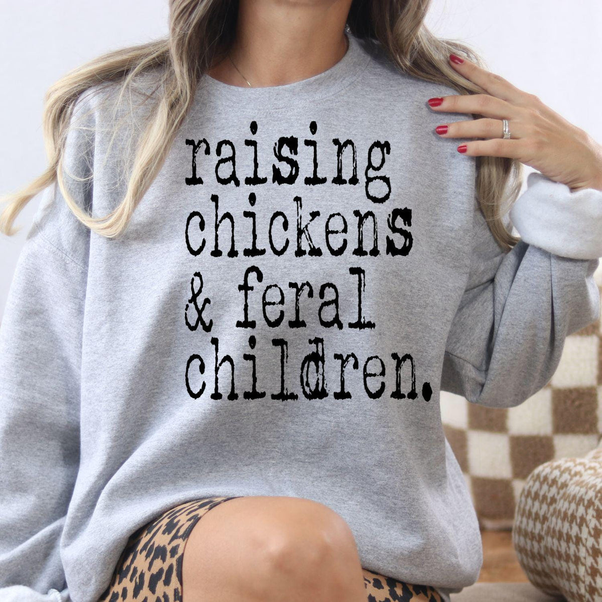 Model wearing sport gray Raising Chickens and Feral Children sweatshirt