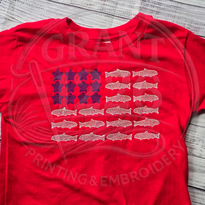 Red toddler embroidered fish and stars flag T-shirt close flat lay