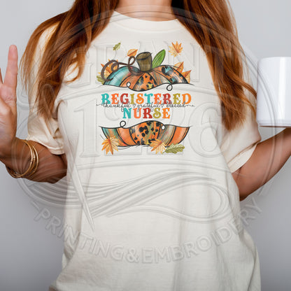 Close view of Ivory Registered Nurse fall pumpkin shirt graphic
