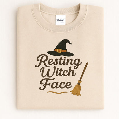 Folded Sand Gildan Resting Witch Face embroidered crewneck