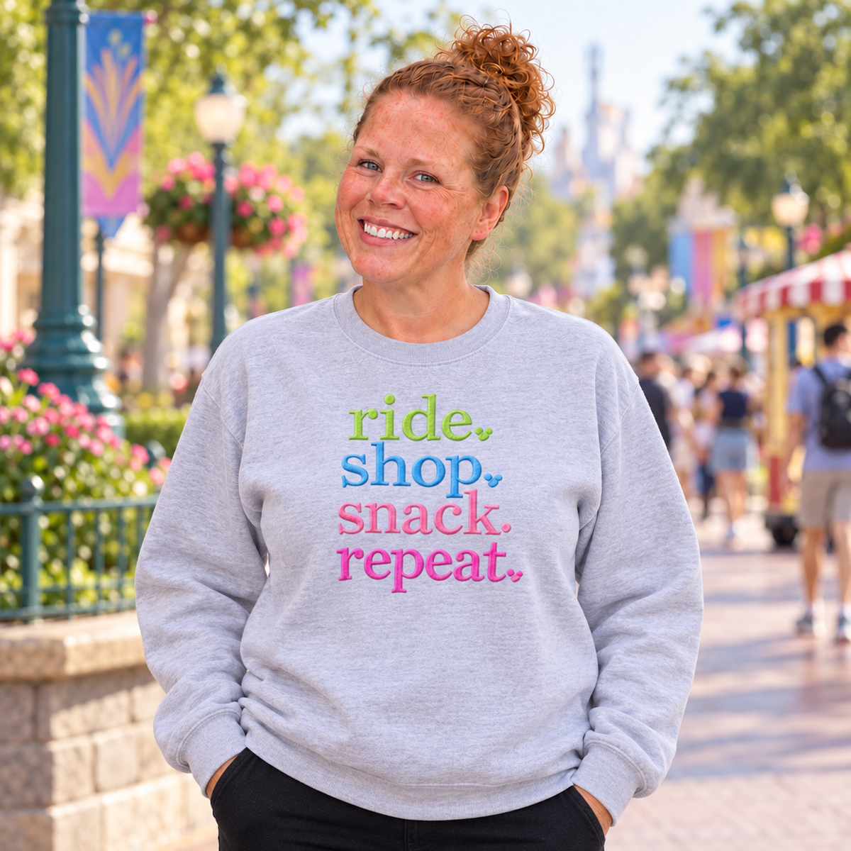 Woman wearing an Ash Ride Shop Snack Repeat embroidered sweatshirt