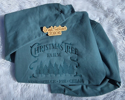Close-up of tone on tone Christmas Tree Farm embroidery stitching
