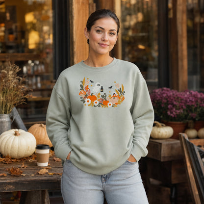 Sage floral ghost mushroom and pumpkin embroidered sweatshirt at a fall market
