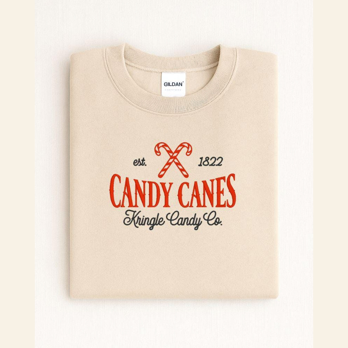 Sand Candy Cane Kringle Candy Co vintage Christmas embroidered crewneck flat lay