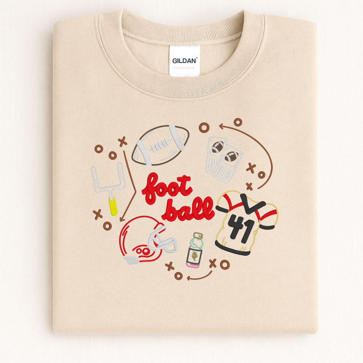 Sand Gildan sweatshirt with colorful embroidered football game day design