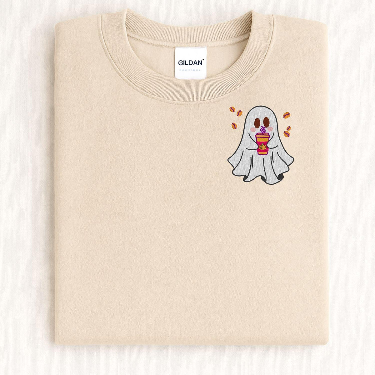 Folded Sand Halloween sweatshirt with embroidered coffee-drinking ghost