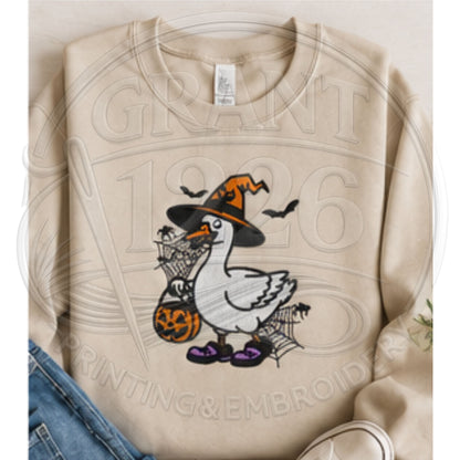 Sand embroidered spooky goose sweatshirt featuring Halloween witch goose and jack-o-lantern treat bucket