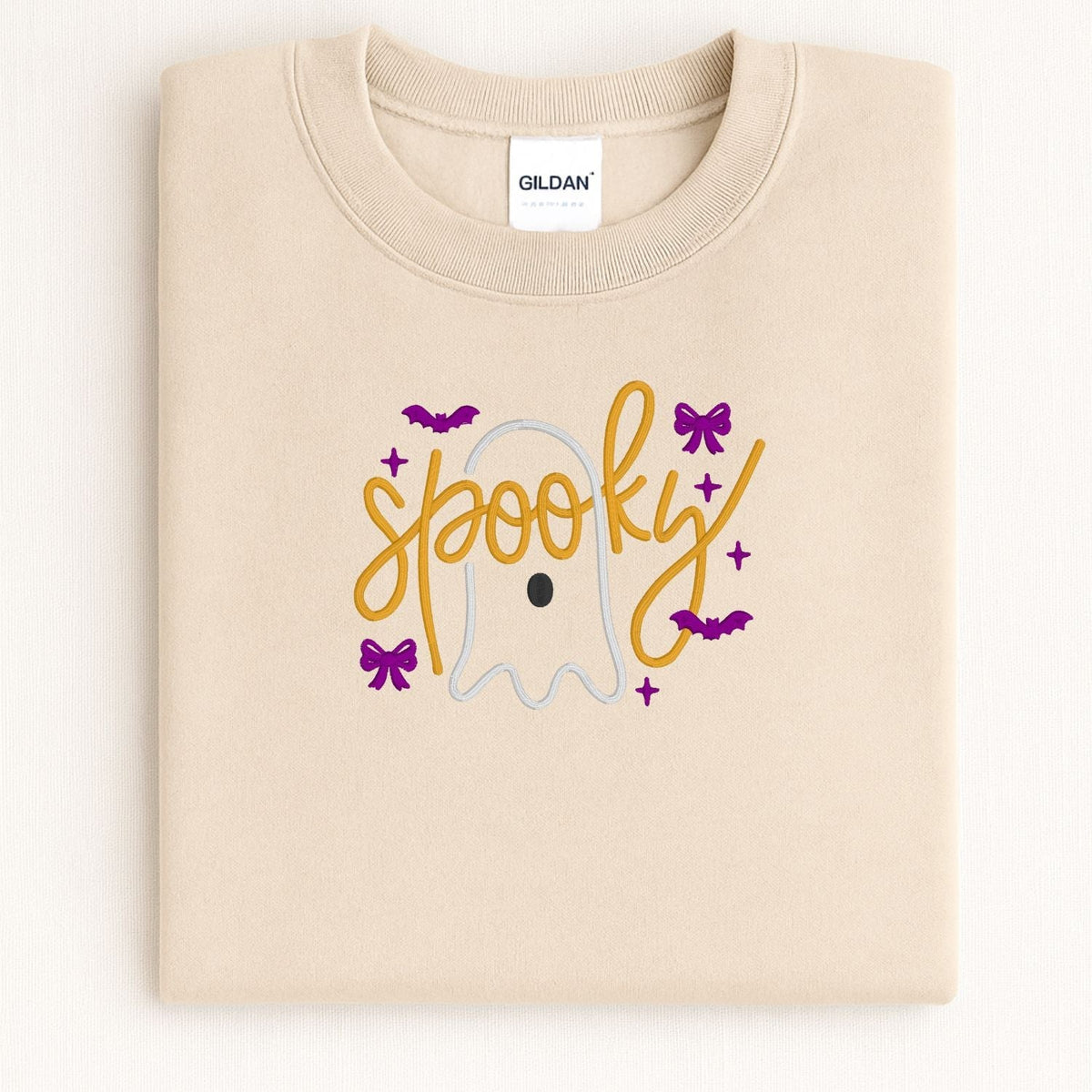 Folded Sand Halloween sweatshirt with ghost, bows and embroidered Spooky script