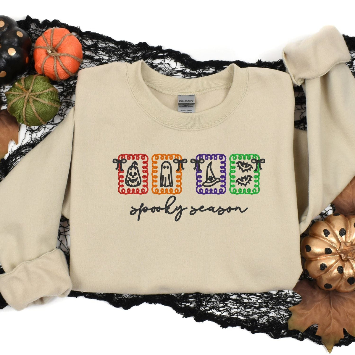 Sand embroidered Halloween sweatshirt styled with pumpkins and black lace