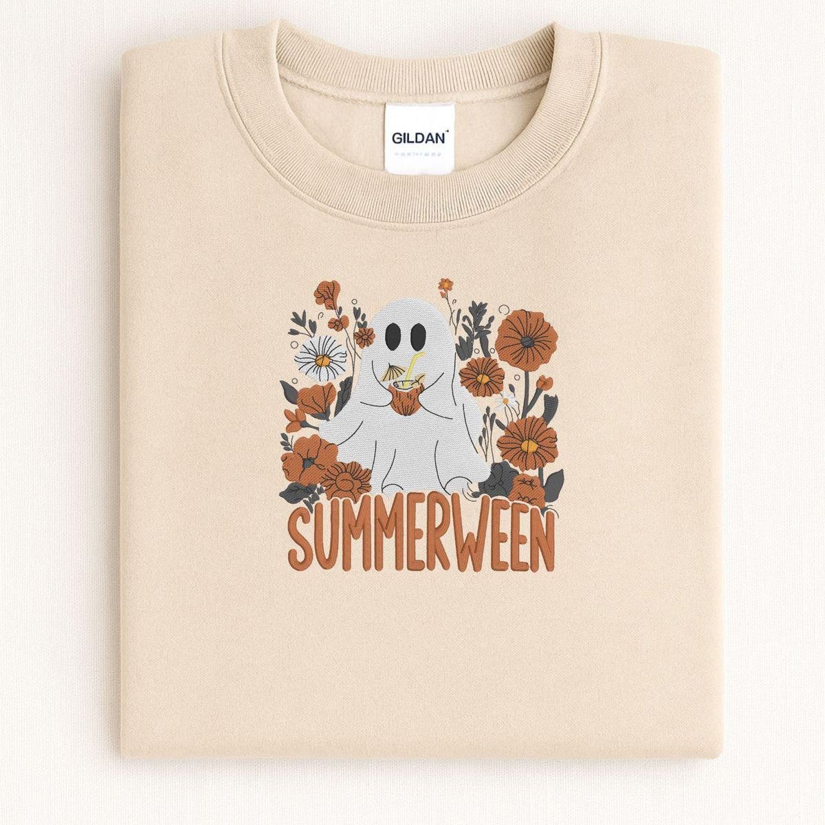 Folded Sand Summerween ghost embroidered sweatshirt showing the full stitched design