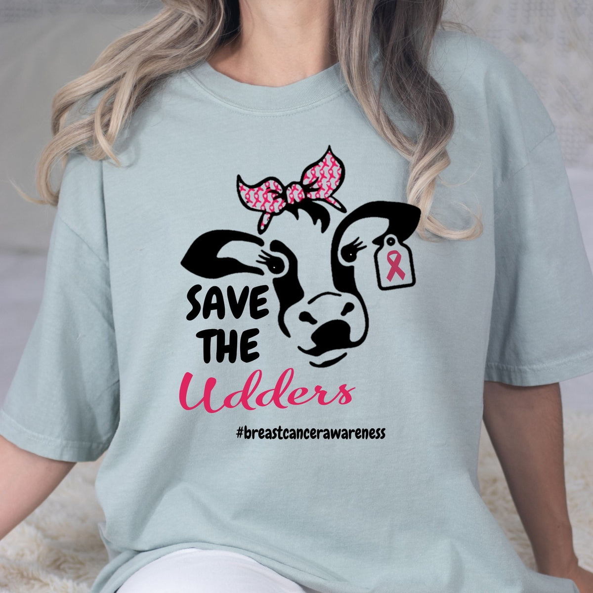 Blue Save the Udders cow graphic T-shirt styled with white jeans