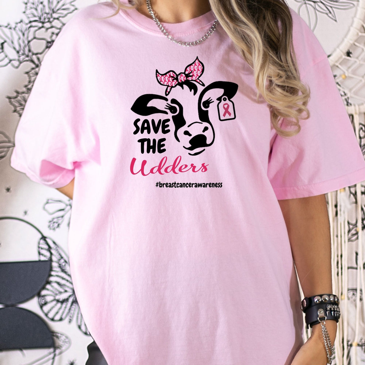 Close-up of the pink Save the Udders breast cancer awareness shirt