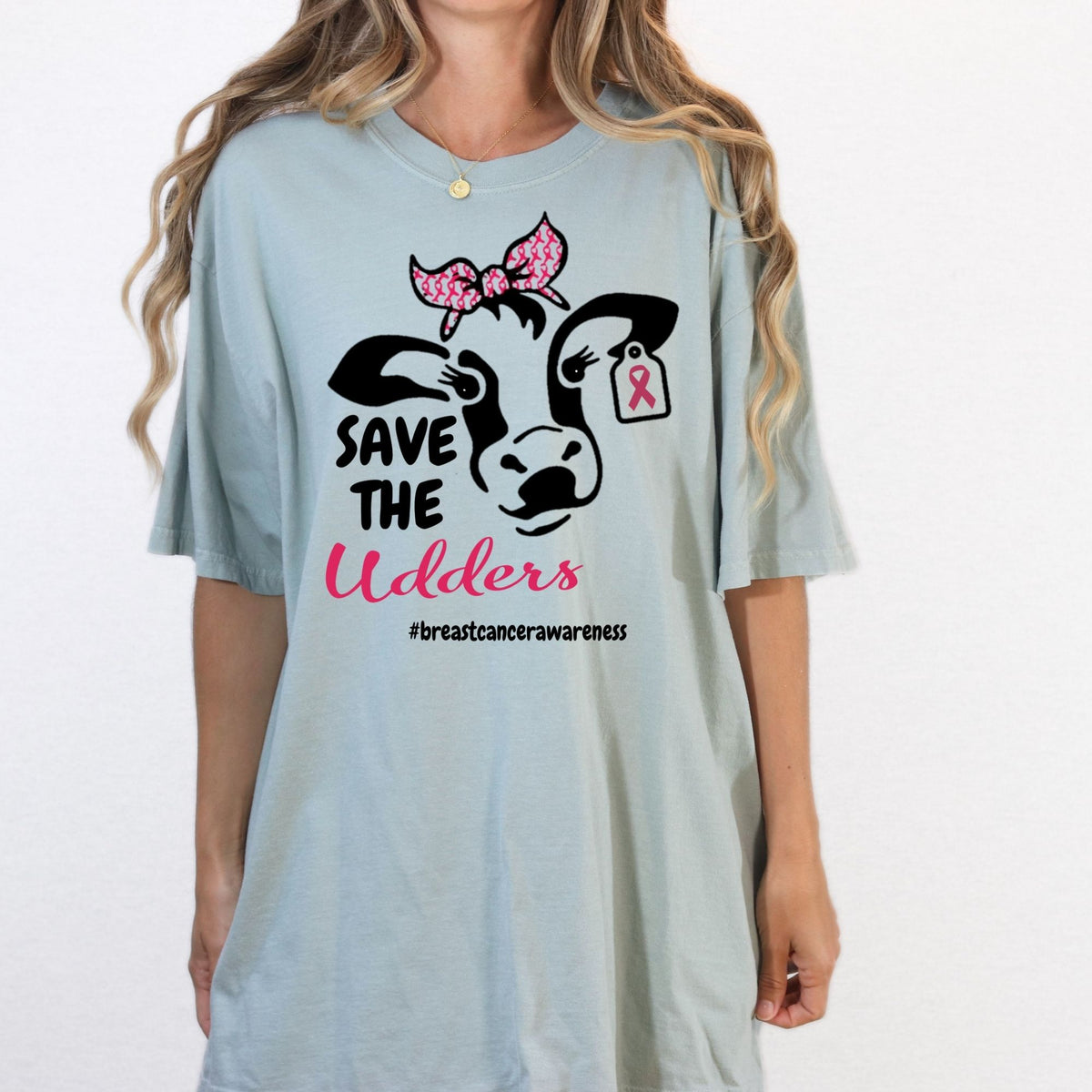 Blue Save the Udders breast cancer awareness cow shirt modeled from the front