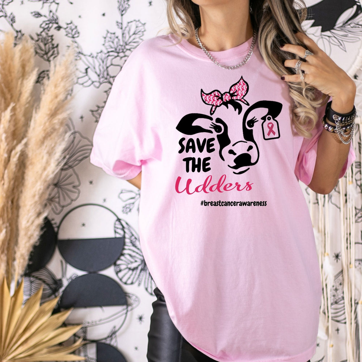 Pink Save the Udders breast cancer awareness shirt styled indoors