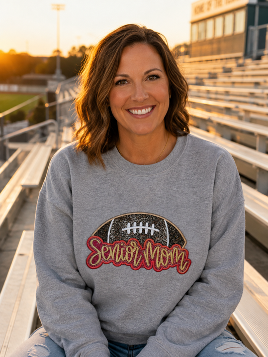 Sport Grey Senior Mom football glitter vinyl applique embroidered Gildan sweatshirt at football stadium