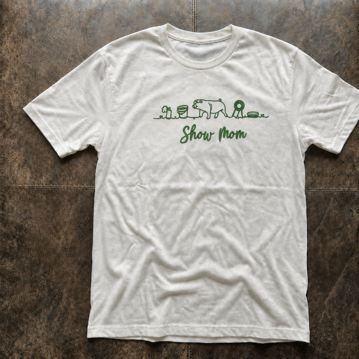 Ivory Comfort Colors 1717 Show Pig Mom shirt with green embroidery flat lay