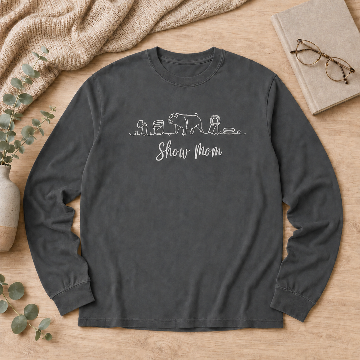 Pepper Comfort Colors 6014 Show Pig Mom shirt with white embroidery flat lay