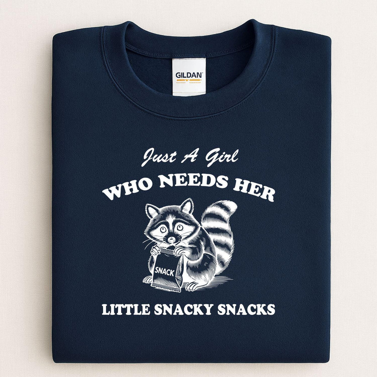 Navy Just a Girl Who Needs Her Little Snacky Snacks raccoon sweatshirt folded flat