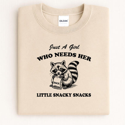 Sand Just a Girl snacky raccoon crewneck folded for a front view