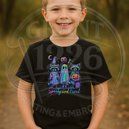 Youth wearing black Spooky and Feral raccoon ghost Halloween shirt