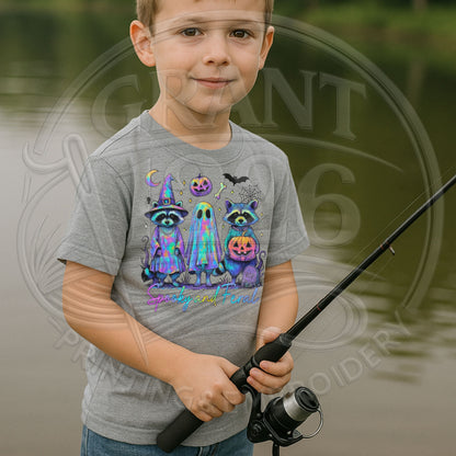 Child wearing gray Spooky and Feral raccoon ghost Halloween shirt outdoors