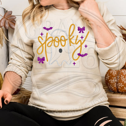 Sand Spooky embroidered crewneck sweatshirt shown in a fall pumpkin setting