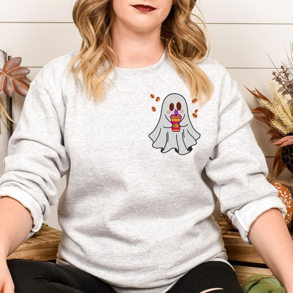 Ash ghost coffee embroidered sweatshirt shown in a fall lifestyle setting