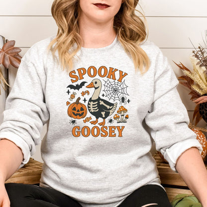 Ash Spooky Goosey skeleton goose sweatshirt in a fall lifestyle setting