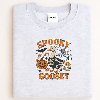 Folded ash sweatshirt with orange and black Spooky Goosey Halloween embroidery
