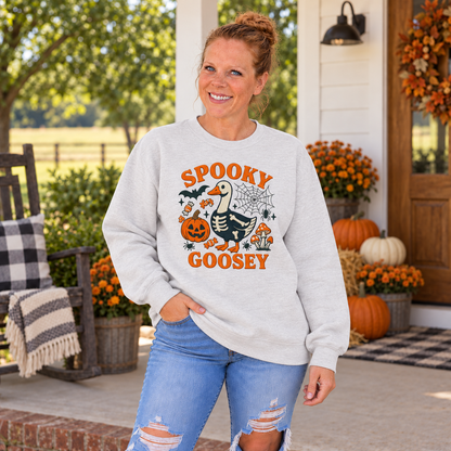 Woman wearing Ash Spooky Goosey embroidered Halloween sweatshirt