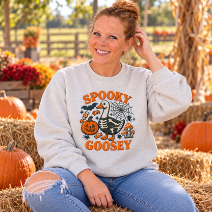 Woman wearing Ash Spooky Goosey embroidered sweatshirt at pumpkin patch