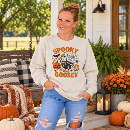Woman wearing Sand Spooky Goosey embroidered sweatshirt on a fall porch