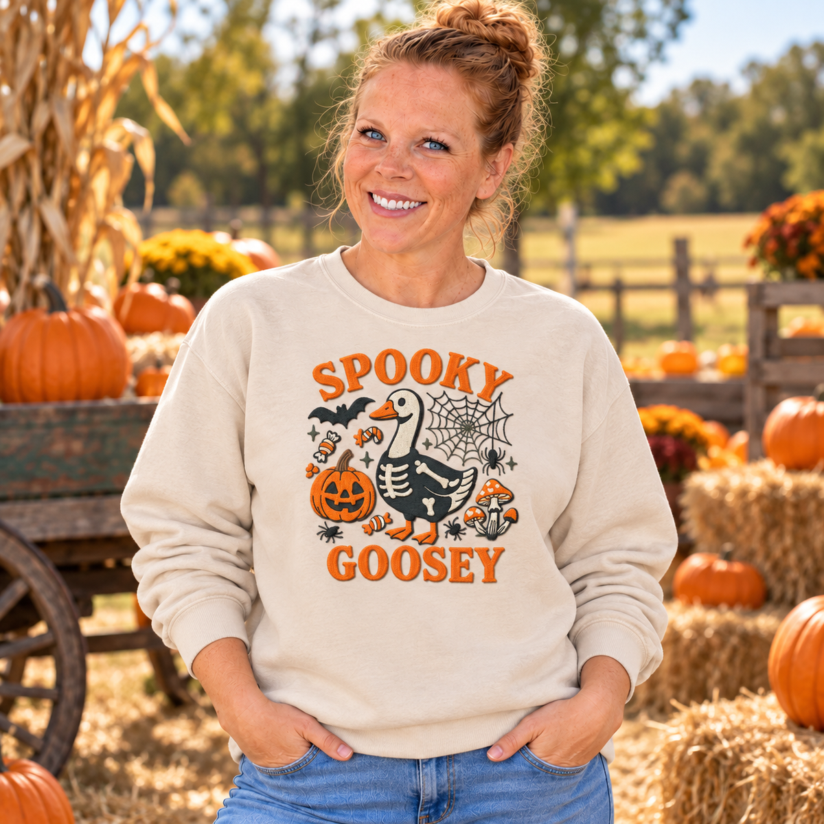 Woman wearing Sand Spooky Goosey embroidered Halloween sweatshirt