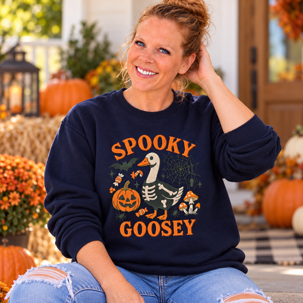 Close detail of raised Spooky Goosey embroidery on Navy sweatshirt