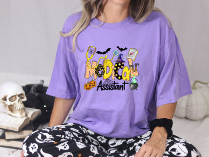 Violet Comfort Colors Medical Assistant Halloween shirt styled with a skull and spooky pajama pants.