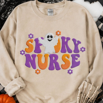 Sand Gildan Spooky Nurse embroidered crewneck with purple orange ghost Halloween design