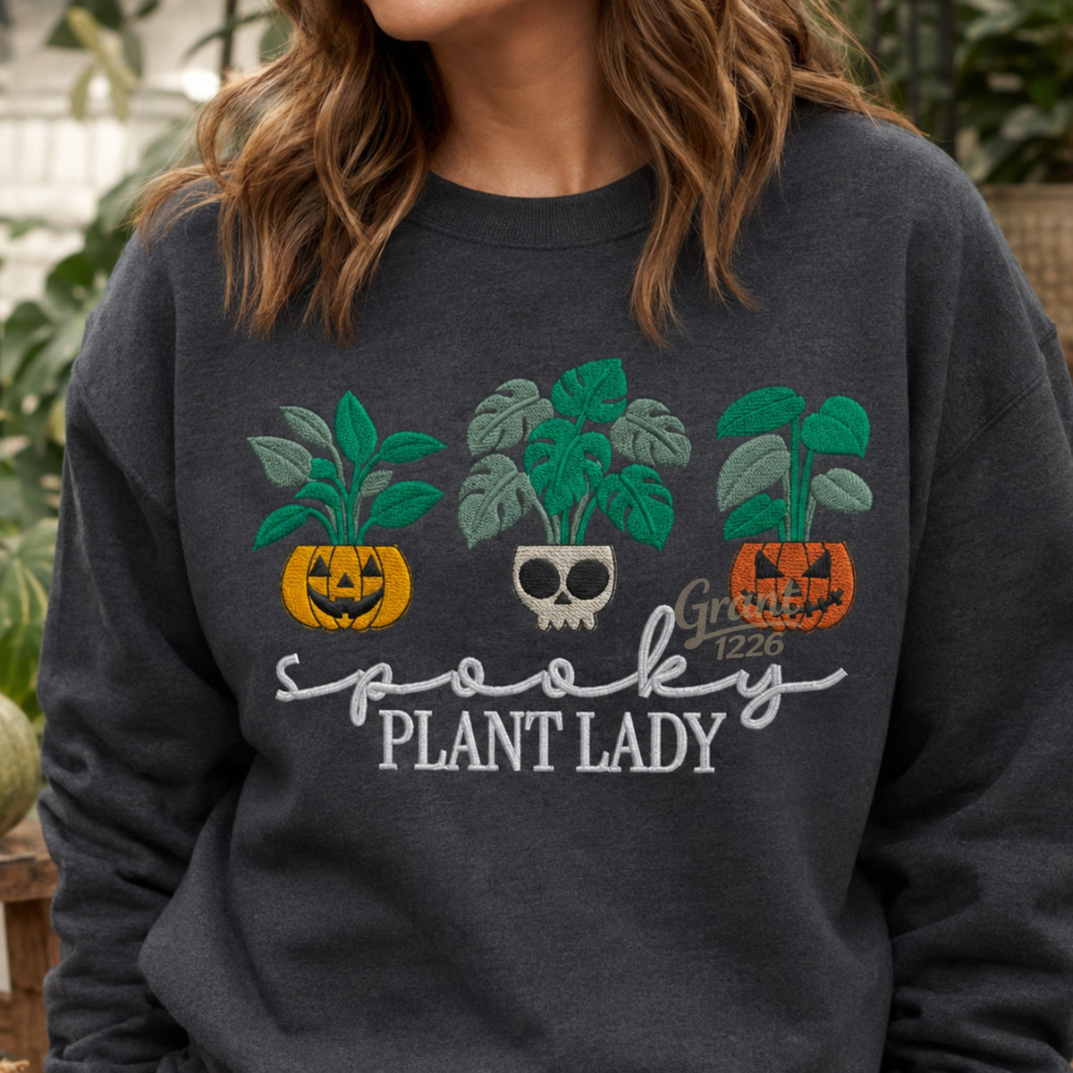Charcoal Heather Gildan heavyweight crewneck with embroidered Spooky Plant Lady Halloween plant design.