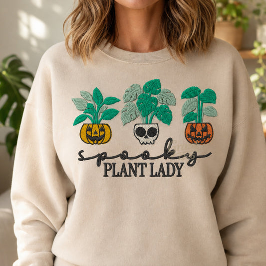 Cropped lifestyle view of sand Spooky Plant Lady embroidered Halloween sweatshirt
