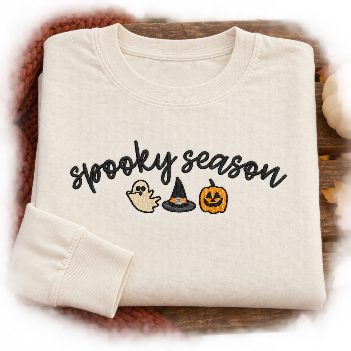 Folded ivory Comfort Colors 6014 long sleeve tee with Spooky Season embroidery