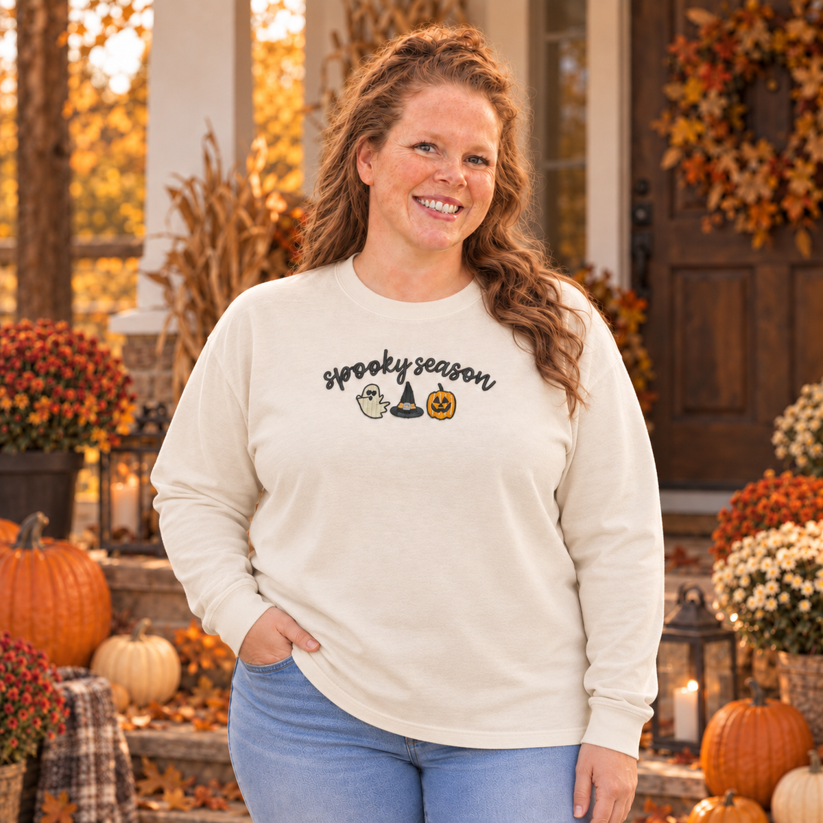 Woman wearing an ivory Comfort Colors 6014 Spooky Season embroidered long sleeve tee