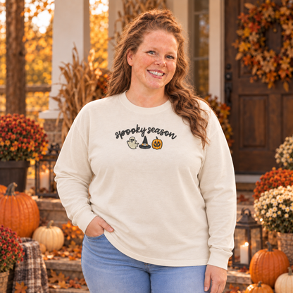 Woman wearing an ivory Comfort Colors 6014 Spooky Season embroidered long sleeve tee