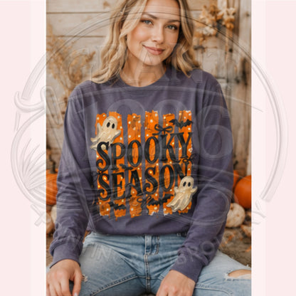 Woman wearing Grape Comfort Colors Spooky Season long sleeve Halloween shirt with retro ghost design